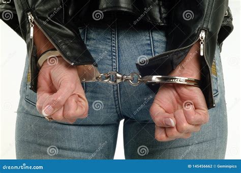 woman handcuffed behind back